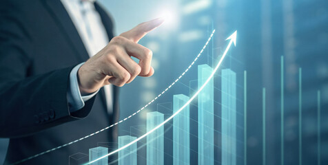Businessman hand touching transparent virtual growth chart showing upward trend and glowing arrow of success, optimistic financial progress