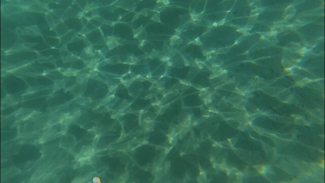 Diving Under Ocean caustics sunlight diving
