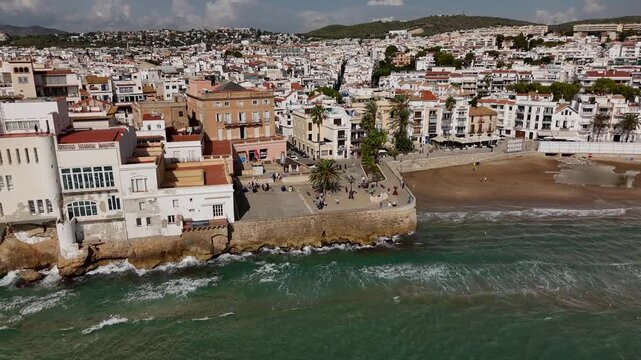 Drone orbit around old promenade in Sitges, Spain.