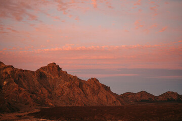 Warm sunset glow panorama over Tenerife's volcanic terrain, excellent for travel blogs, nature photography, and stock photo markets
