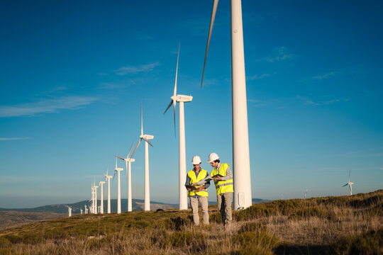 Engineers Inspecting Wind Turbine on a Sunny Day &ndash; Spain