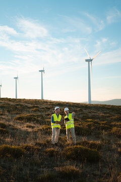 Engineers Inspecting Wind Turbine on a Sunny Day &ndash; Spain