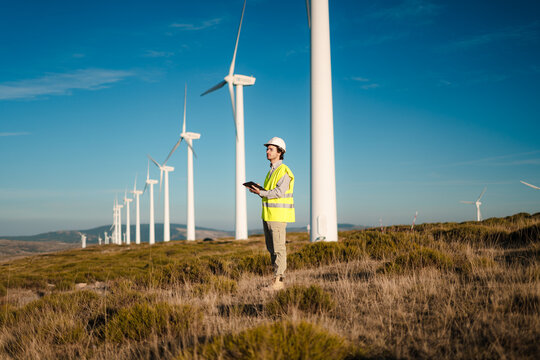 Engineer Using Digital Tablet at Wind Farm &ndash; Spain