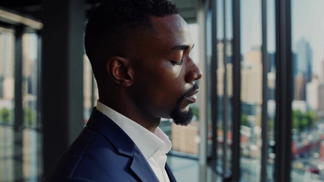 Suite window overlooking city skyline and glass facade; executive in suit pauses in reflective silence, morning light and highrise panorama, contemplative posture and distant horizon