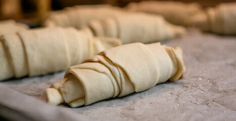 Raw croissant on sheet