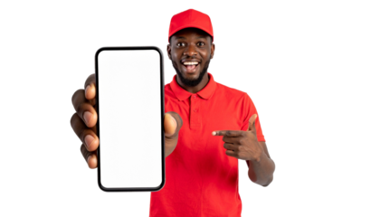An individual in a red uniform joyfully pointing towards a mobile phone, emphasizing its features