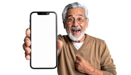 An excited older man holds and points to his phone with a blank screen. Showing a close up of the happy man. Showing the latest technology in his hand
