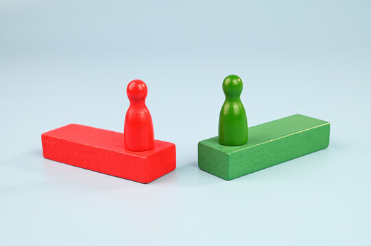 Two figurines facing each other.