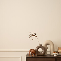 Minimalist composition of living room interior with copy space, wooden sideboard, vase with dried flowers, modern sculpture, books, beige wall with stucco and personal accessories. Home decor Template