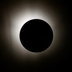 A low-angle shot silhouetting a ball in motion against a bright backlight, creating a dramatic effect with the light source directly behind the subject