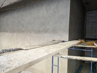 construction autoclaved aerated concrete wall with rusted scaffold