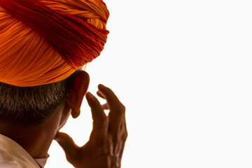 Hindu man with orage turban. Copy space.