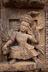 Intricate Carved Statue of a Dancing Deity in Patan Durbar Square – Ancient Nepali Artistry
