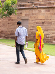 A couple of young hindu people visiting Amber Fort (Jaipur, Rajasthan, India).