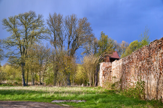 Medieval defensive walls made of brick and stone in the town of Osno
