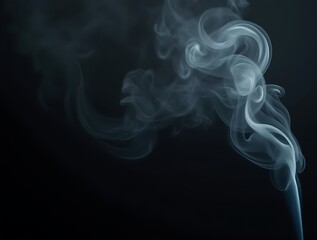 Wispy white smoke swirling and curling against a dark black background steam vapor image