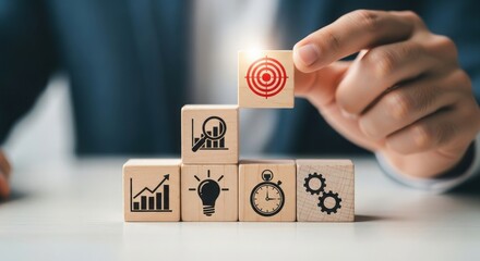 Naklejka premium Hand placing target block on wooden blocks representing business goals and strategy