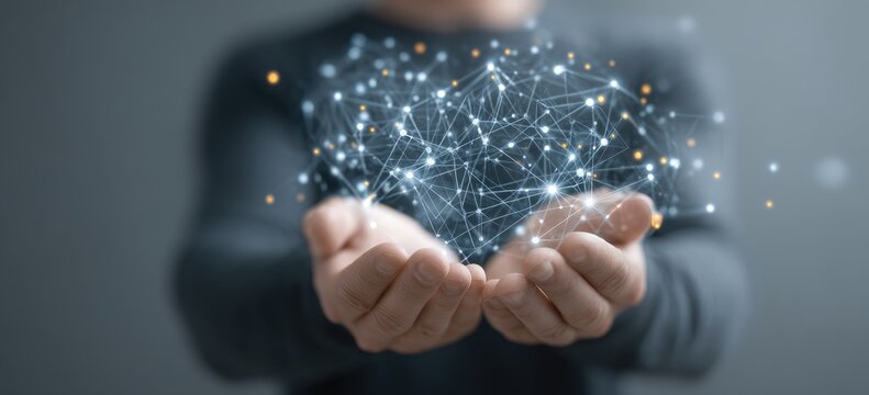 Hands cradle glowing interconnected digital network