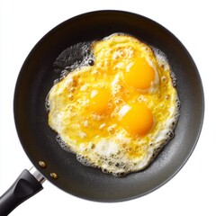 Three Sunny Side Up Eggs Cooking in a Nonstick Pan Over Medium Heat on a Bright Kitchen Countertop