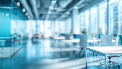 Modern, bright office space with cubicles, desks, and large windows