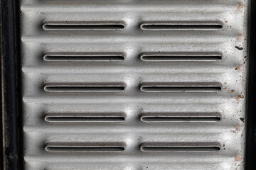 Radiator core with clean tubes. Automotive cooling system repair and maintenance concept.