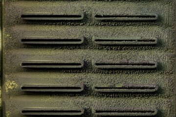 Dirty radiator core with sludge in tubes. Automotive cooling system repair and maintenance concept.