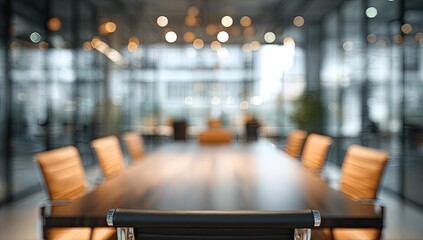 Blurred conference room with chairs around a large table