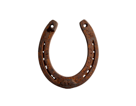 A rusty metal horseshoe with nail holes, set against a stark black backdrop