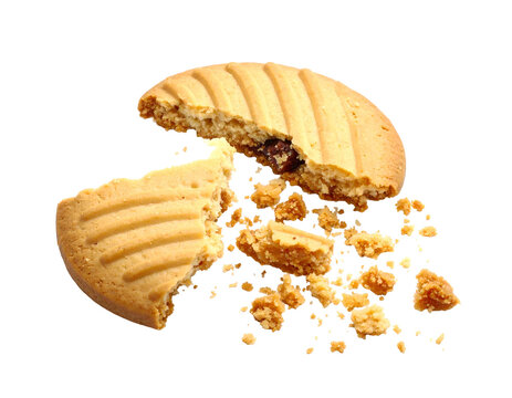 A broken round biscuit reveals a dark filling, crumbs scattered on a black background