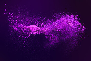 Plakat Dynamic Explosion of Vibrant Purple Powder Particles Scattering Against a Dark Background