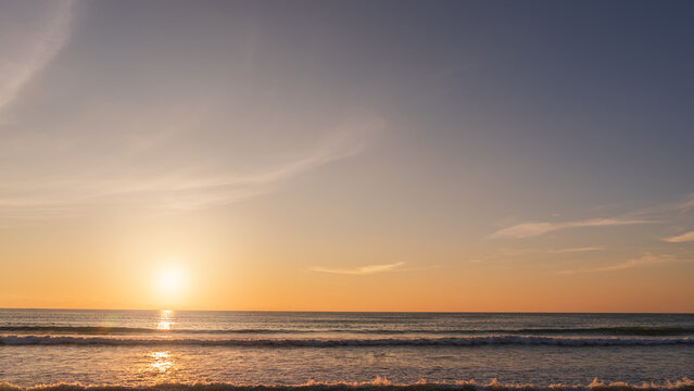 Fototapeta Sunset, Sky cloud background over sea in the Evening with Orange, Yellow Gold sunlight sun dawn in Golden hour and Dramatic fluffy, Horizon morning sunny sunrise sea Summer sky landscape, Dusk sky