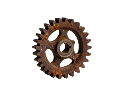 Close-up of a heavily rusted gear wheel with prominent teeth against black
