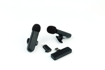 modern wireless microphone system with two clip-on transmitters and a receiver on white background, ideal for smartphone recording podcasting vlogging and professional audio production content creator