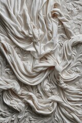 Draped fabric in elegant relief with intricate carved details