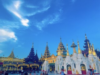 Fototapeta premium Shwedagon Pagoda in Yangon Myanmar, Famous Golden Buddhist Temple Landmark with Blue Sky