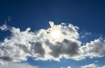 Sunlight Breaks Through Autumn Clouds in Blue Sky