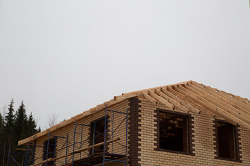 Roof construction for a house. Making a wooden formwork for the roof.
