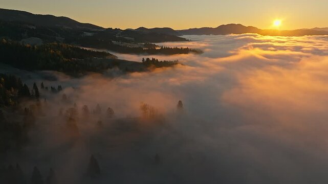 A Stunning Sunrise Over a Foggy Valley Landscape in the Morning
