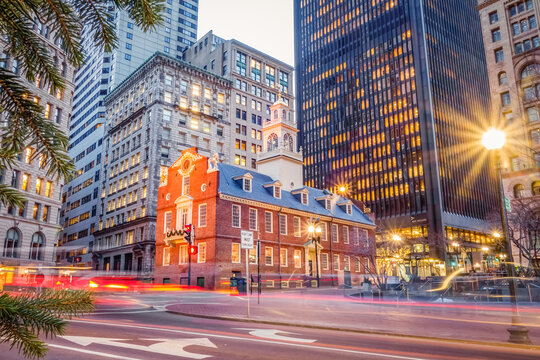 BOSTON, MA, USA &ndash; DECEMBER 21, 2025:  Rush hour traffic near the historic Old State House in Boston's Financial District. The Old State House is famous as the location of the Boston Massacre.