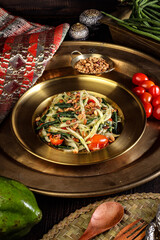 Traditional Thai Green Papaya Salad Som Tum with Fresh Vegetables and Herbs.