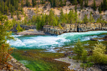 Scenic View of Emerald Kootenay River Through Forest Mountains