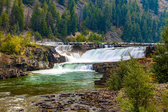 Panoramic View of Kootenai Falls in Forested Mountains