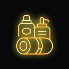 Yellow glowing neon sign of bathroom amenities including towels, shampoo and liquid soap on a black background