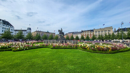 07 August, 2024, Copenhagen city center, Denmark Summer day scenic canal with boats and tourists, cyclists riding along colorful buildings and waterfront, vibrant urban atmosphere in European capital