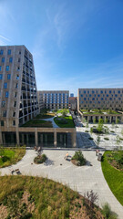 07 August, 2024, Copenhagen city center, Denmark Summer day scenic canal with boats and tourists, cyclists riding along colorful buildings and waterfront, vibrant urban atmosphere in European capital