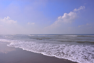 The scenic view from Laboni Point, a popular tourist spot on Cox's Bazar beach. Calm waves of the Bay of Bengal meet the sand under a beautiful blue sky. A perfect Bangladesh travel image.