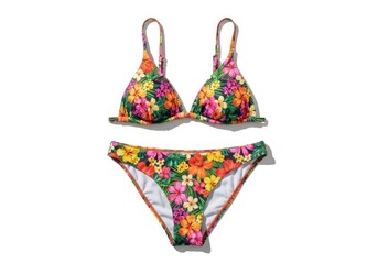 A set of two-piece swimwear adorned with a multi-colored floral pattern of diverse blossoms and green leaves on a dark background laid out on a white surface