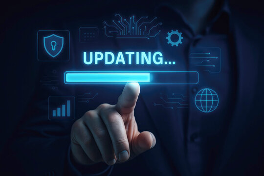 Finger pressing a glowing blue progress bar labeled UPDATING with digital icons on a dark background