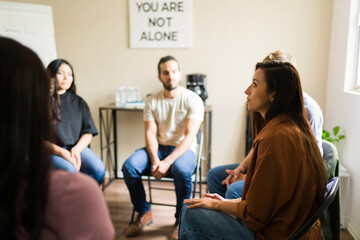 Supportive people sharing feelings during group therapy session