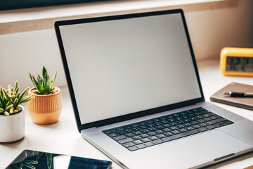 Calm modern workspace with laptop mockup and plants, representing digital creativity, remote work and mindful productivity balance.